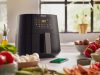 Philips Essential XL Airfryer – Review A Philips Essential XL Airfryer surrounded by food