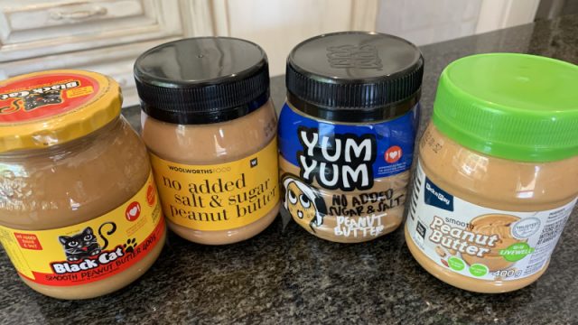 Four sugar-free peanut butters in jars