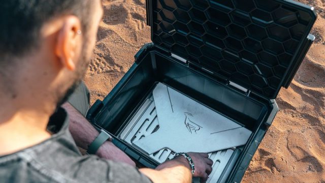 Craig opens the Front Runner Wolf Pack Pro box to reveal the BBQ/Fire Pit braai.