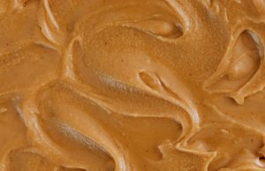 Woollies vs Yum Yum: who makes the best caramel peanut butter? A beautiful close-up of peanut butter