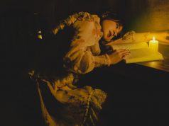 Energizer Vision 1200 Rechargeable Lantern – Review A beautiful woman reading a book by candlelight.