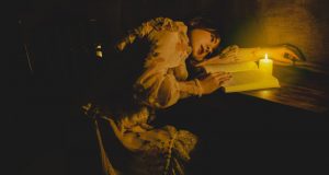 Energizer Vision 1200 Rechargeable Lantern – Review A beautiful woman reading a book by candlelight.