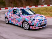 Next MINI Cooper could have a 400 km range The 2024 electric Mini Cooper, in pink camo, going round the track.