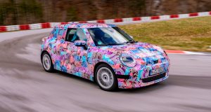 Next MINI Cooper could have a 400 km range The 2024 electric Mini Cooper, in pink camo, going round the track.