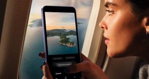 Nine things you must know about the new Samsung Galaxy S24 Woman on a plane taking a picture of scenery