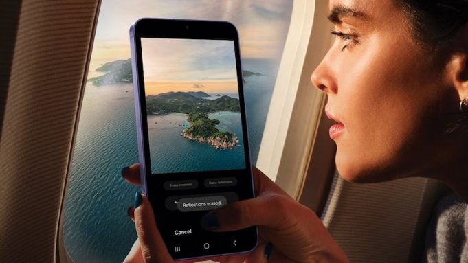 Nine things you must know about the new Samsung Galaxy S24 Woman on a plane taking a picture of scenery